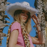 white cowgirl hat with faux fur rim and tiara
